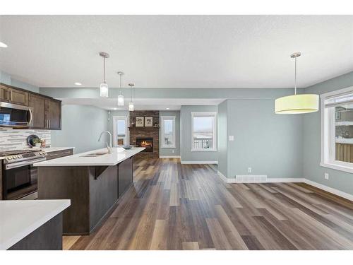 868 Lakewood Circle, Strathmore, AB - Indoor Photo Showing Kitchen With Fireplace With Stainless Steel Kitchen With Upgraded Kitchen