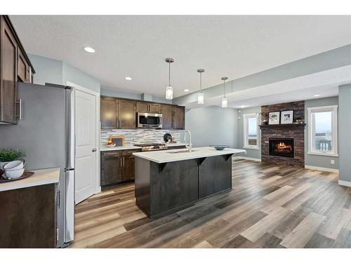 868 Lakewood Circle, Strathmore, AB - Indoor Photo Showing Kitchen With Fireplace With Stainless Steel Kitchen With Upgraded Kitchen