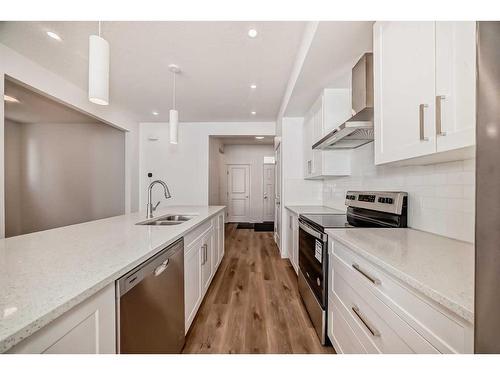 369 Magnolia Way Se, Calgary, AB - Indoor Photo Showing Kitchen With Stainless Steel Kitchen With Double Sink With Upgraded Kitchen