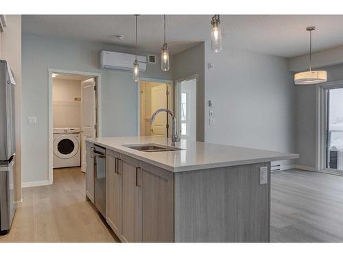 3113-550 Belmont Street Sw, Calgary, AB - Indoor Photo Showing Kitchen With Double Sink