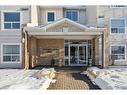 106-5555 Falsbridge Drive Ne, Calgary, AB  - Outdoor With Deck Patio Veranda With Facade 