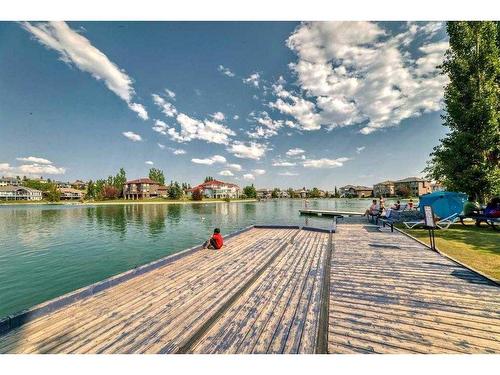 153 Arbour Wood Mews Nw, Calgary, AB - Outdoor With Body Of Water With Deck Patio Veranda With View