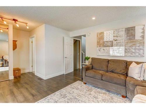 153 Arbour Wood Mews Nw, Calgary, AB - Indoor Photo Showing Living Room