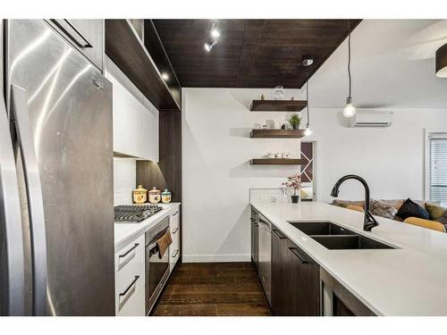 308-2702 17 Avenue Sw, Calgary, AB - Indoor Photo Showing Kitchen With Double Sink With Upgraded Kitchen