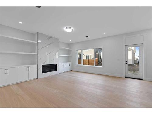 145 Saddlecrest Circle Ne, Calgary, AB - Indoor Photo Showing Living Room With Fireplace