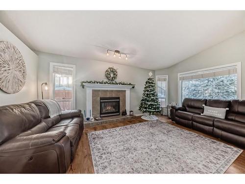 83 Sheep River Heights, Okotoks, AB - Indoor Photo Showing Living Room With Fireplace