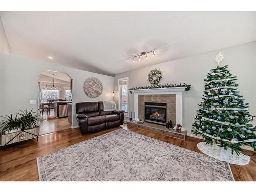 83 Sheep River Heights, Okotoks, AB - Indoor Photo Showing Living Room With Fireplace