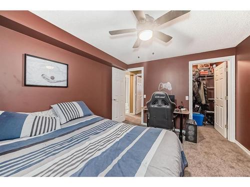 83 Sheep River Heights, Okotoks, AB - Indoor Photo Showing Bedroom