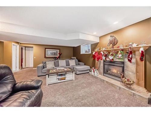 83 Sheep River Heights, Okotoks, AB - Indoor Photo Showing Living Room With Fireplace