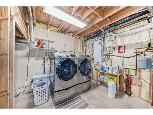 83 Sheep River Heights, Okotoks, AB - Indoor Photo Showing Laundry Room