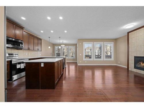 144 Mahogany Terrace Se, Calgary, AB - Indoor Photo Showing Other Room With Fireplace