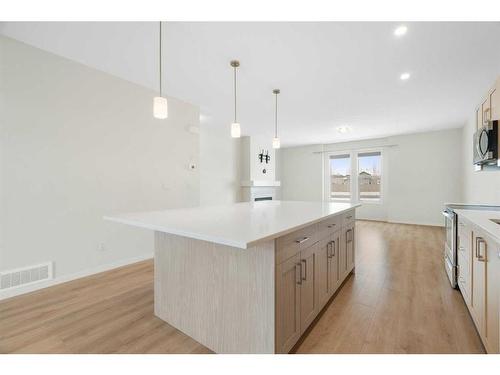 322 South Point Square Sw, Airdrie, AB - Indoor Photo Showing Kitchen With Upgraded Kitchen