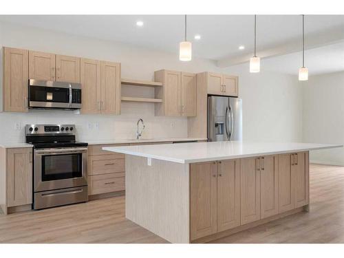 322 South Point Square Sw, Airdrie, AB - Indoor Photo Showing Kitchen With Upgraded Kitchen