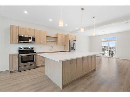 322 South Point Square Sw, Airdrie, AB - Indoor Photo Showing Kitchen With Upgraded Kitchen