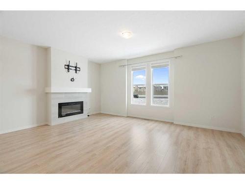 322 South Point Square Sw, Airdrie, AB - Indoor Photo Showing Living Room With Fireplace