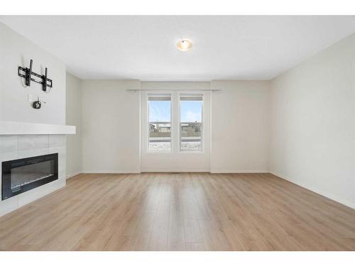 322 South Point Square Sw, Airdrie, AB - Indoor Photo Showing Living Room With Fireplace