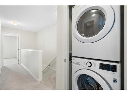 322 South Point Square Sw, Airdrie, AB - Indoor Photo Showing Laundry Room