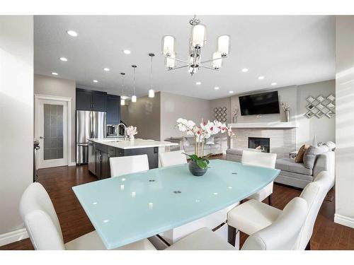 373 Nolan Hill Boulevard Nw, Calgary, AB - Indoor Photo Showing Dining Room With Fireplace