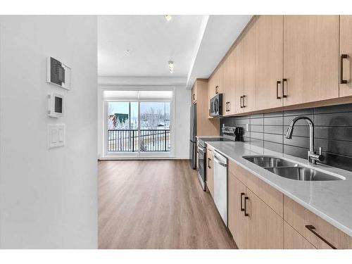 216-60 Sage Hill Walk Nw, Calgary, AB - Indoor Photo Showing Kitchen With Double Sink