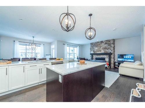 39 Legacy Glen Terrace Se, Calgary, AB - Indoor Photo Showing Kitchen With Fireplace