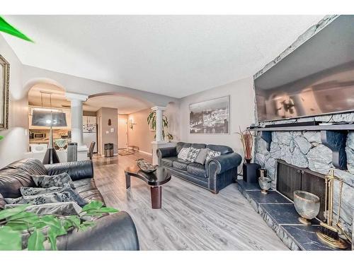 302-1001 68 Avenue Sw, Calgary, AB - Indoor Photo Showing Living Room With Fireplace