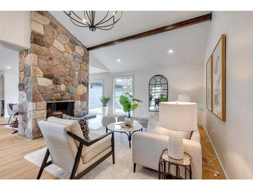 20 Varbay Place Nw, Calgary, AB - Indoor Photo Showing Living Room With Fireplace