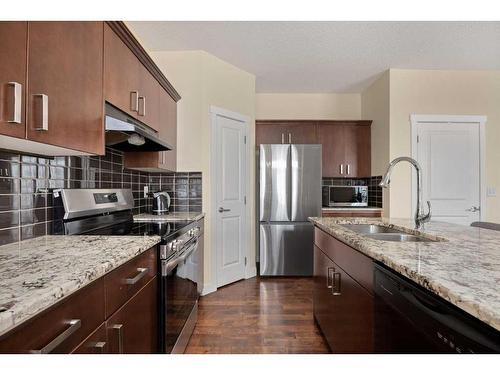 173 Rockyspring Grove Nw, Calgary, AB - Indoor Photo Showing Kitchen With Double Sink With Upgraded Kitchen