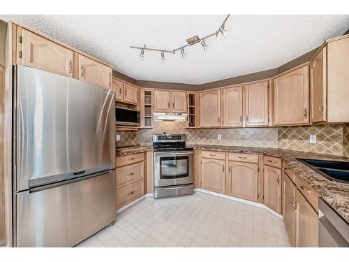 16290 Shawbrooke Drive Sw, Calgary, AB - Indoor Photo Showing Kitchen With Double Sink