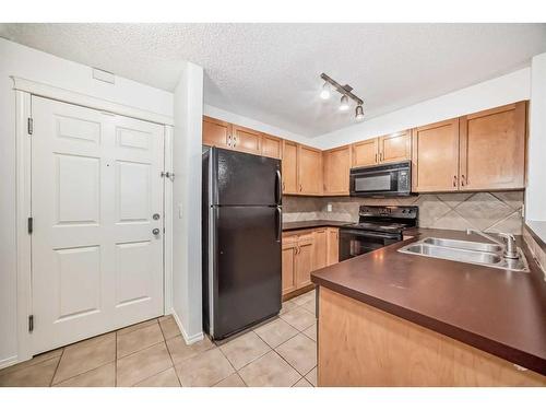 9118-70 Panamount Drive Nw, Calgary, AB - Indoor Photo Showing Kitchen With Double Sink