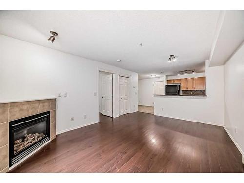 9118-70 Panamount Drive Nw, Calgary, AB - Indoor Photo Showing Living Room With Fireplace