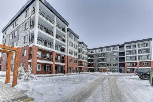 1409-111 Wolf Creek Drive Se, Calgary, AB - Outdoor With Balcony With Facade