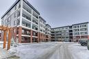 1409-111 Wolf Creek Drive Se, Calgary, AB  - Outdoor With Balcony With Facade 