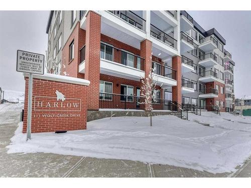 1409-111 Wolf Creek Drive Se, Calgary, AB - Outdoor With Balcony With Facade