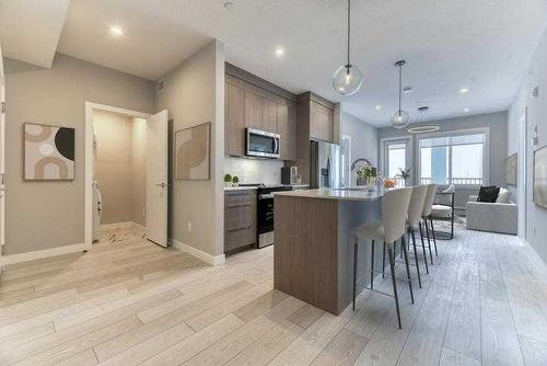 1409-111 Wolf Creek Drive Se, Calgary, AB - Indoor Photo Showing Kitchen With Upgraded Kitchen