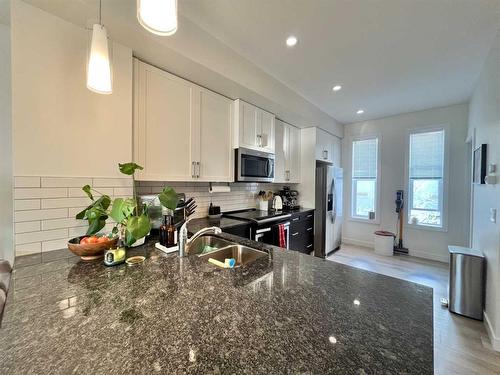 29 Legacy Path Se, Calgary, AB - Indoor Photo Showing Kitchen With Double Sink With Upgraded Kitchen