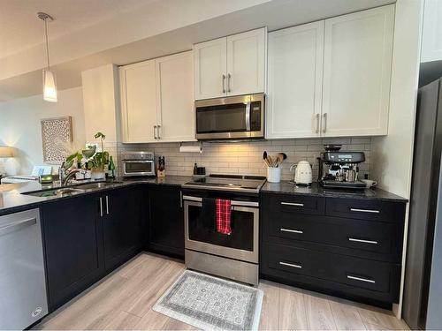 29 Legacy Path Se, Calgary, AB - Indoor Photo Showing Kitchen With Stainless Steel Kitchen With Upgraded Kitchen