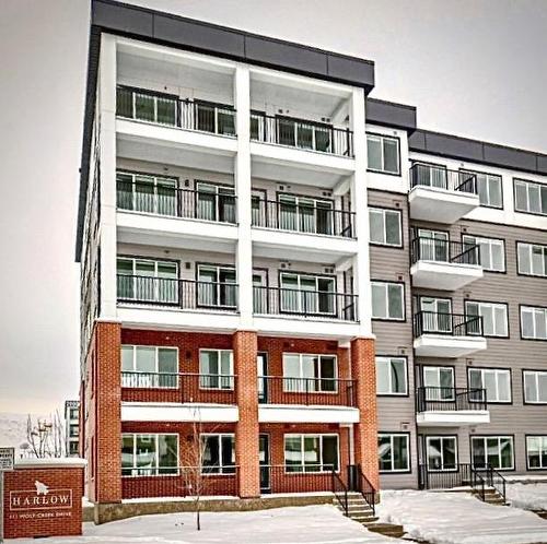 1515-111 Wolf Creek Drive Se, Calgary, AB - Outdoor With Balcony With Facade