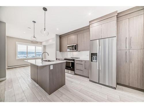 1515-111 Wolf Creek Drive Se, Calgary, AB - Indoor Photo Showing Kitchen With Stainless Steel Kitchen With Upgraded Kitchen