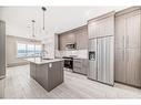 1515-111 Wolf Creek Drive Se, Calgary, AB  - Indoor Photo Showing Kitchen With Stainless Steel Kitchen With Upgraded Kitchen 