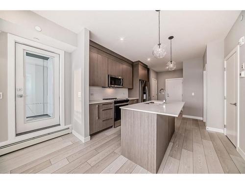 1515-111 Wolf Creek Drive Se, Calgary, AB - Indoor Photo Showing Kitchen With Upgraded Kitchen