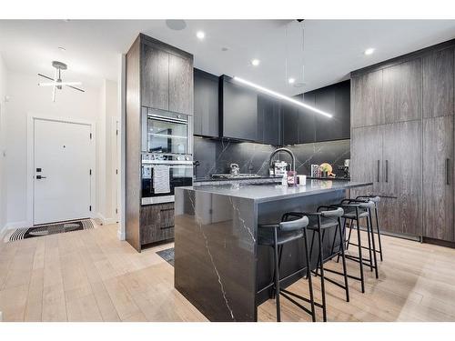 205-835 78 Street Sw, Calgary, AB - Indoor Photo Showing Kitchen With Upgraded Kitchen