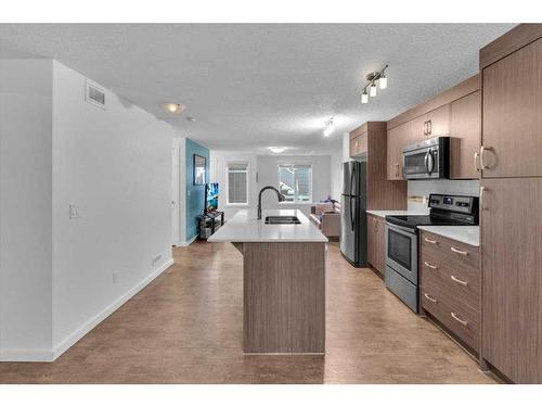 107 Auburn Bay Street Se, Calgary, AB - Indoor Photo Showing Kitchen With Stainless Steel Kitchen