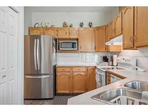 501-39 Hidden Creek Place Nw, Calgary, AB - Indoor Photo Showing Kitchen With Double Sink