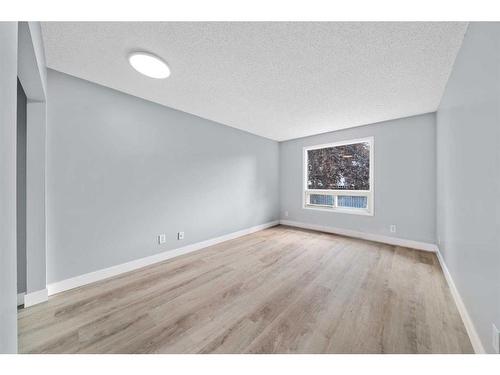 110-1712 38 Street Se, Calgary, AB - Indoor Photo Showing Other Room