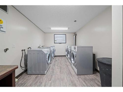 110-1712 38 Street Se, Calgary, AB - Indoor Photo Showing Laundry Room