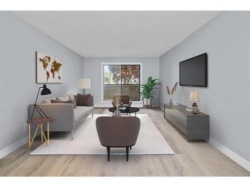 110-1712 38 Street Se, Calgary, AB - Indoor Photo Showing Living Room