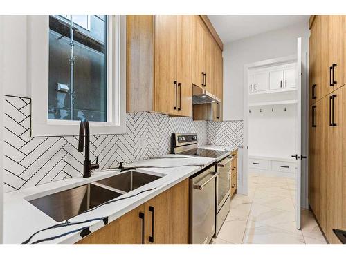 219 Kinniburgh Loop, Chestermere, AB - Indoor Photo Showing Kitchen With Double Sink