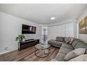 228 Riverglen Drive Se, Calgary, AB  - Indoor Photo Showing Living Room 