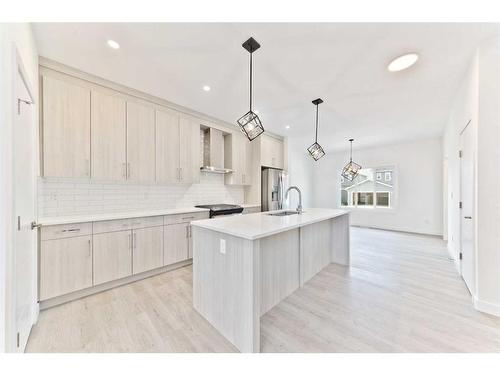 816 Midtown Drive Sw, Airdrie, AB - Indoor Photo Showing Kitchen With Upgraded Kitchen