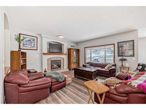 13 Bow Ridge Drive, Cochrane, AB - Indoor Photo Showing Living Room With Fireplace